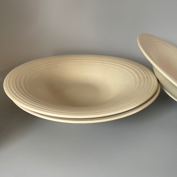 Single sculpted oval beige ceramic appetiser plate – elegant and minimal design for artful food presentation