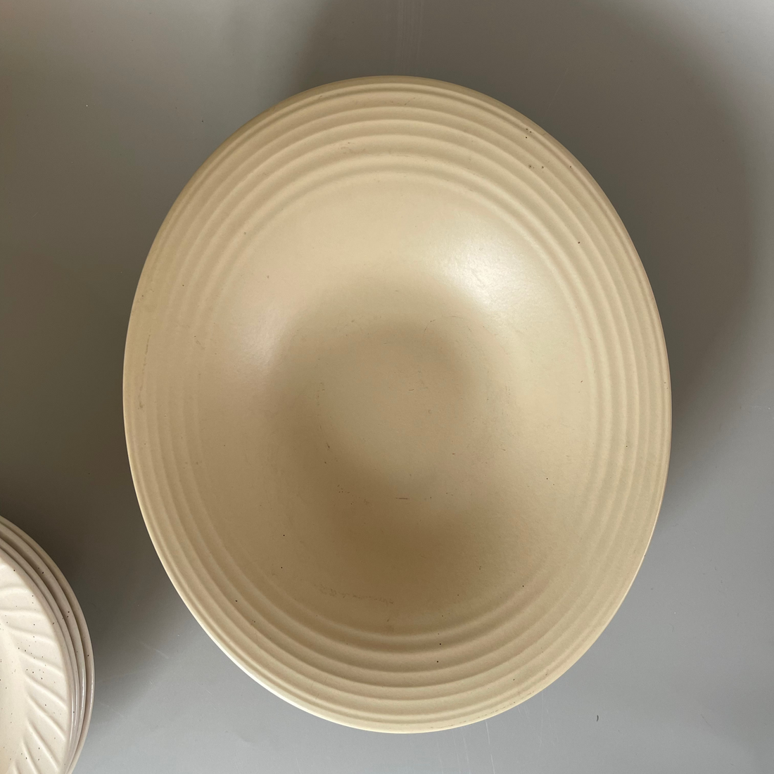 Single sculpted oval beige ceramic appetiser plate – elegant and minimal design for artful food presentation